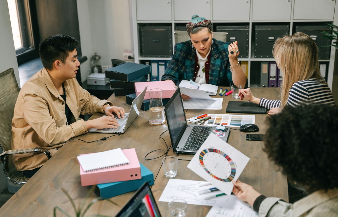 Colleagues planning a digital project around a conference table