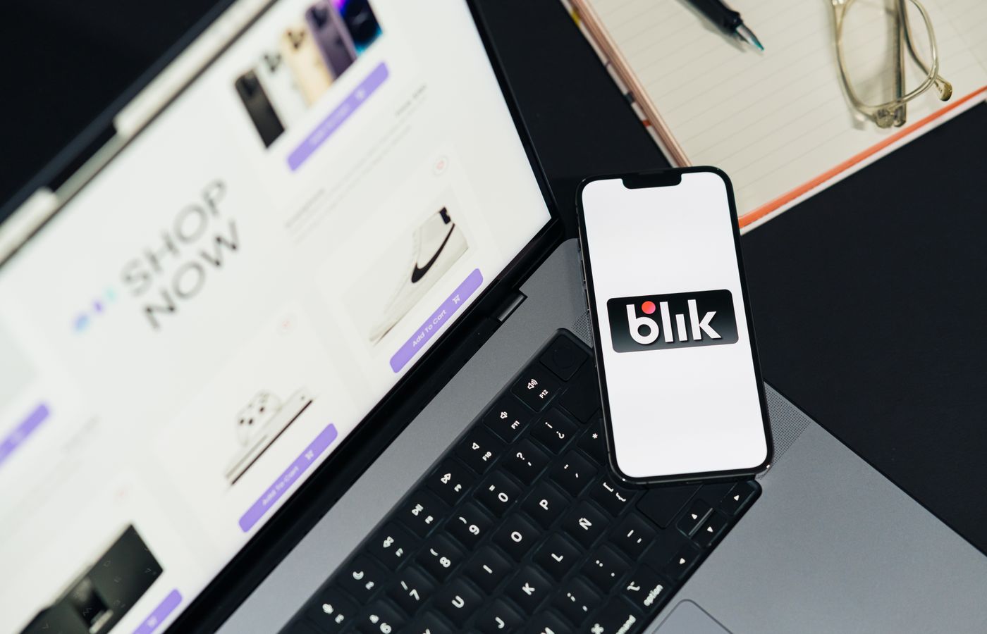 Laptop and smartphone displaying online shopping interfaces