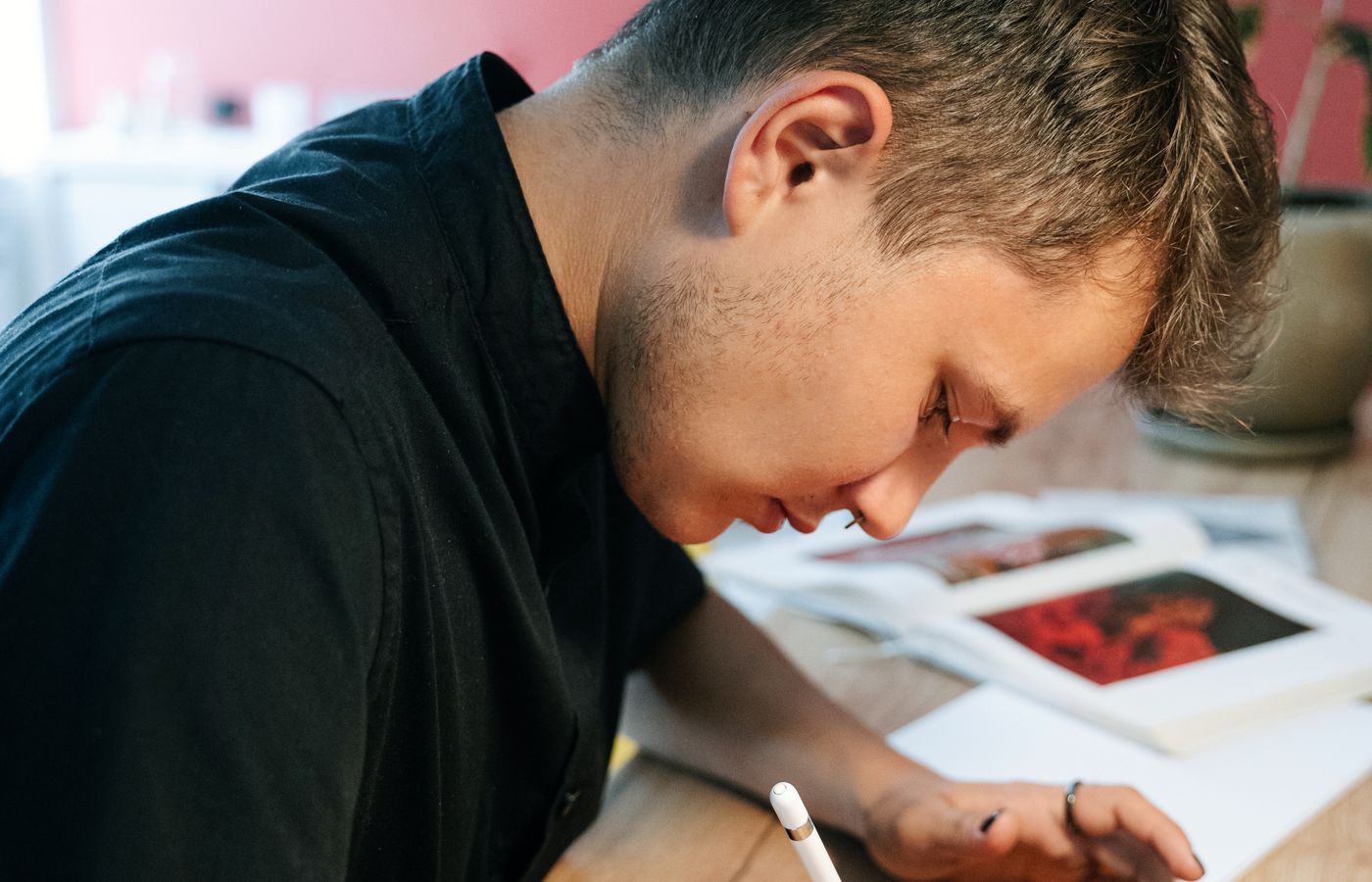 Graphic designer sketching a visual concept at a desk