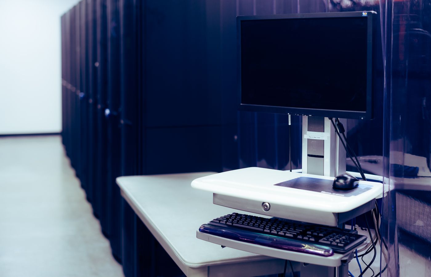 Server racks and a workstation in a data center